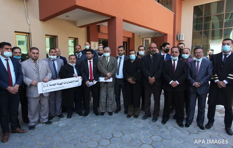 Palestinians from the Bar Association attend a press conference on the occasion of Land Day, in front of the Bar Association headquarters in Gaza City, on April 1, 2021. Palestinians every year mark Land Day on March 30...
