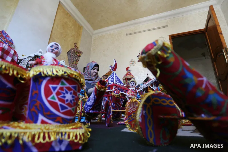 Palestinian Hanan al-Madhoun, 37, builds a traditional lantern, called a "fanous" used as a decoration to celebrate the start of the Muslim holy month of Ramadan, amid the coronavirus disease (COVID-19), at her home in G...