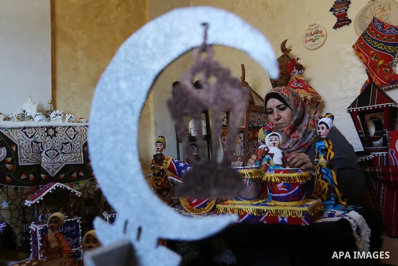 Palestinian Hanan al-Madhoun, 37, builds a traditional lantern, called a "fanous" used as a decoration to celebrate the start of the Muslim holy month of Ramadan, amid the coronavirus disease (COVID-19), at her home in G...