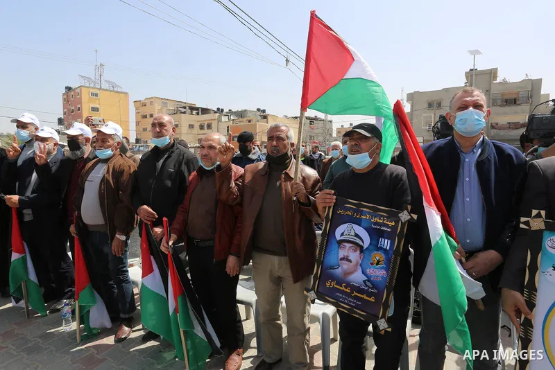 Palestinians take part in the press conference to announce the activities of the National Day of the Palestinian Prisoners' Day entitled (born free), in front of the house of the Palestinian Prisoner, Leader Hassan Salam...