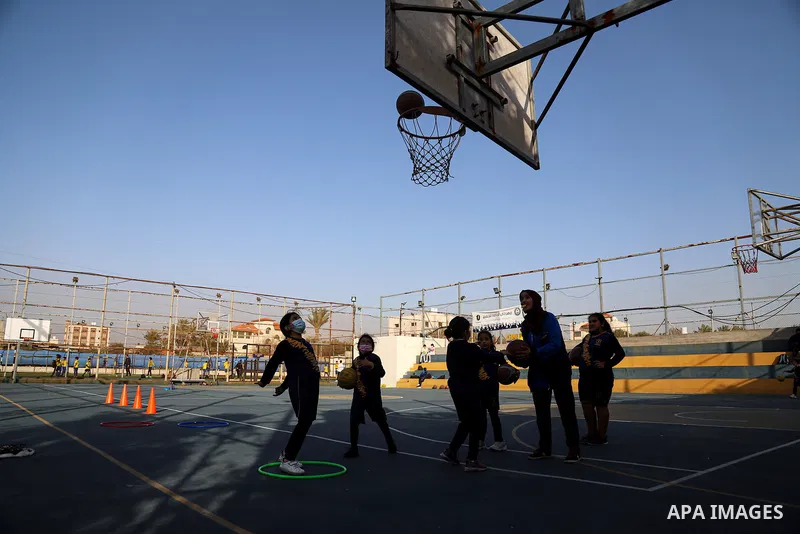 Palestinian children play basketball at Champions Club, on Palestinian Children's Day, in Gaza city on April 5, 2021. Israel continues to detain hundreds of Palestinian children and subject them to military courts amidst...