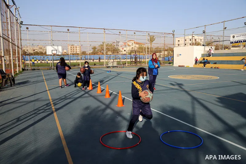 Palestinian children play basketball at Champions Club, on Palestinian Children's Day, in Gaza city on April 5, 2021. Israel continues to detain hundreds of Palestinian children and subject them to military courts amidst...