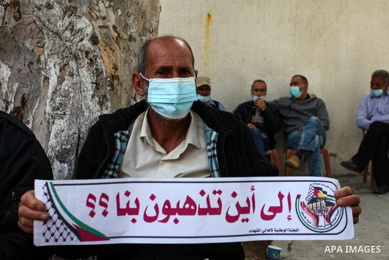 Families of Palestinian martyrs and wounded, take part in a protest against the Palestinian Authority's decision to cut their salaries for seven years, in Gaza city, on April 6, 2021. The Palestinian Central Elections Co...