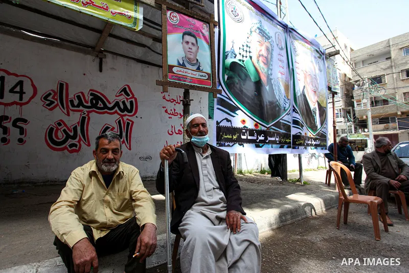 Families of Palestinian martyrs and wounded, take part in a protest against the Palestinian Authority's decision to cut their salaries for seven years, in Gaza city, on April 6, 2021. The Palestinian Central Elections Co...
