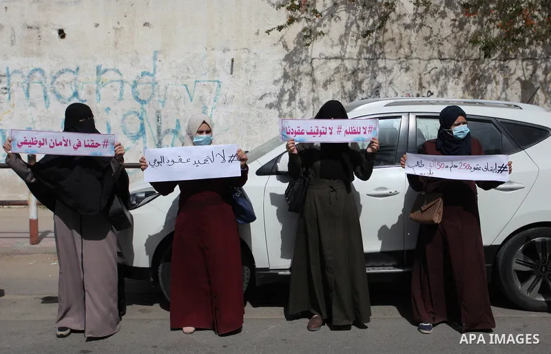 Palestinian teachers take part in a protest demanding their rights in front of the headquarters United Nations Relief and Works Agency (UNRWA), in Gaza City on April 7, 2021. Protesters slammed the agency’s cuts to vital...
