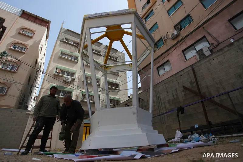 Palestinian men make a big lantern known as "Fanous" in Arabic in preparation for the Muslim holy month of Ramadan, amid the coronavirus disease (COVID-19), in Gaza city on on April 7, 2021. Authorities in the Gaza Strip...