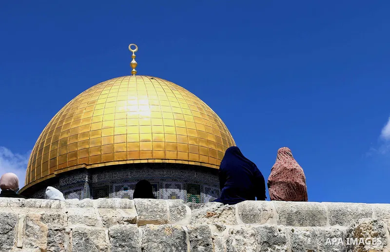 Muslims gather for Friday prayer, next to the Dome of the Rock Mosque in the Al Aqsa Mosque compound in Jerusalem's old city, Friday, April. 9, 2021. Photo by Jamal Awad