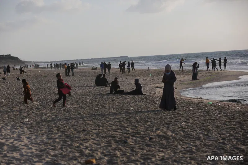 Palestinians enjoy their time on the beach, during a lockdown following the outbreak of the coronavirus disease (COVID-19), in Deir al-Balah in the central Gaza Strip on 09 April, 2021. Palestine today recorded 2,418 new...