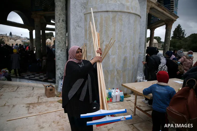 Palestinian volunteers clean Al-Aqsa Mosque compound, ahead the Muslims holy month of Ramadan, in Jerusalem old city on April 10, 2021. Celebrations in Jerusalem for Ramadan this year will certainly be quieter than befor...