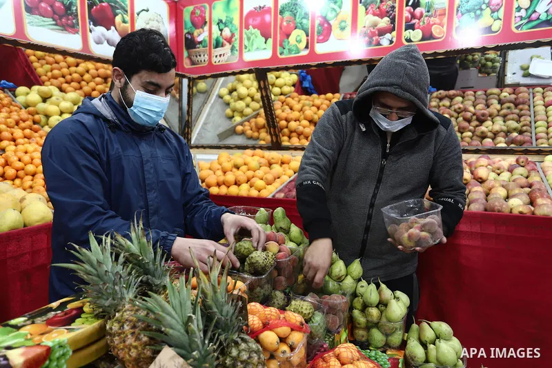 Palestinian vensdors sell fruits and vegetables, in Gaza city, on April 11, 2021. Celebrations in Gaza strip for Ramadan this year will certainly be quieter than before the coronavirus pandemic. Photo by Mahmoud Ajjour