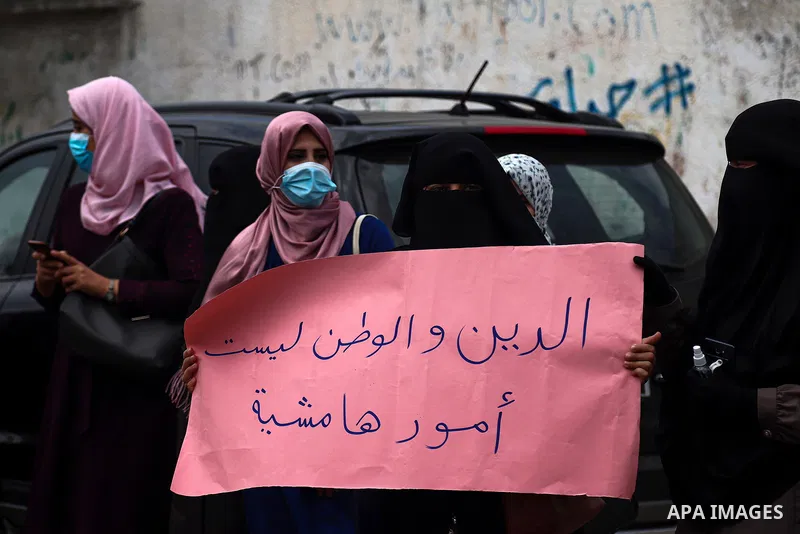 Palestinian teachers take part in a protest demanding their rights in front of the headquarters United Nations Relief and Works Agency (UNRWA), in Gaza City on April 11, 2021. The teachers in the United Nations Relief an...
