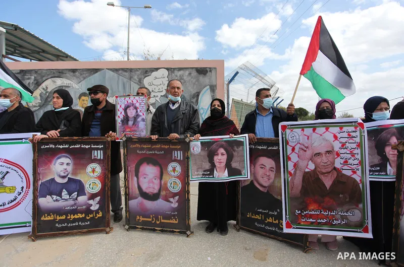 Palestinian of the Popular Front for the Liberation of Palestine and the Islamic Jihad Movement, take part in a protest to solidarity prisoners in Israeli jails on Palestinian Prisoners' Day, in front of Erez crossing, i...