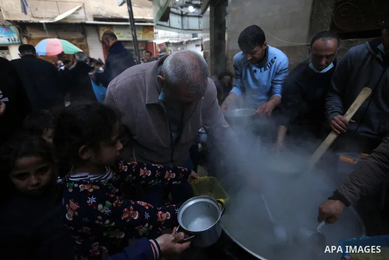 A Palestinian man distributes free food for Poor families during the holy fasting month of Ramadan, in al-Shijaiyah neighborhood in Gaza city, on April 14, 2021. The territory of Gaza, which is one of the most populated...