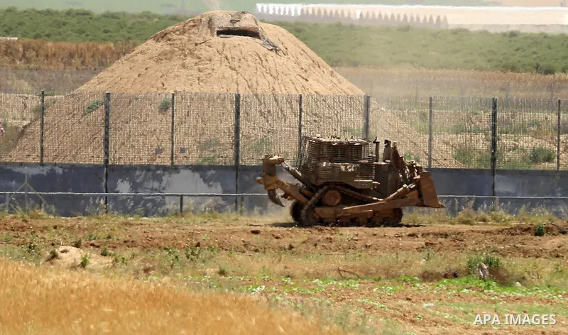 Israeli bulldozers work at the Israel-Gaza border, east of Gaza City on April 21, 2021. The Israeli army today infiltrated Gaza’s border, east of Gaza city, and leveled farmlands. Photo by Ashraf Amra