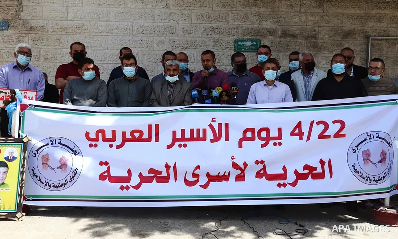 Palestinian members of the National and Islamic forces, take part in a protest to solidarity with Arab prisoners, in Israeli Jails, on the Arab Prisoner Day, in front of Red cross office, in Gaza city, on April 22, 2021....
