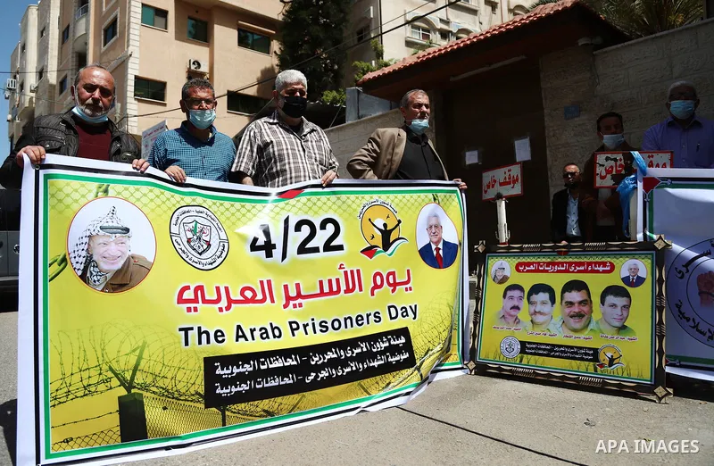 Palestinian members of the National and Islamic forces, take part in a protest to solidarity with Arab prisoners, in Israeli Jails, on the Arab Prisoner Day, in front of Red cross office, in Gaza city, on April 22, 2021....