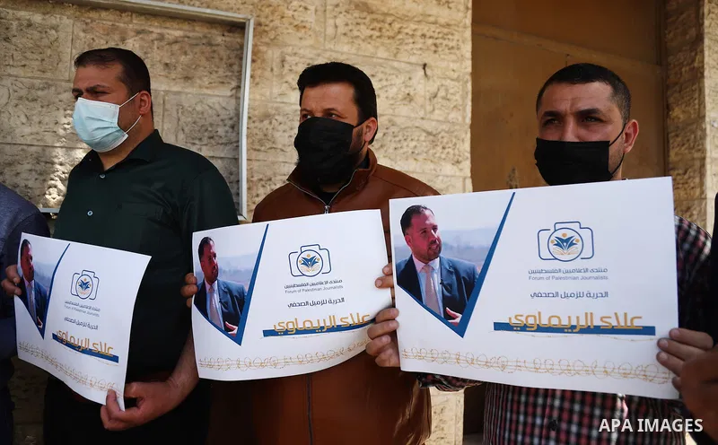 Palestinian journalists take part in a protest demanding to release of their colleague Alaa al-Rimawi, 43, who was arrested by Israeli forces, in the Red Cross office, in Gaza city, on April 22, 2021. Al-Rimawi works as...