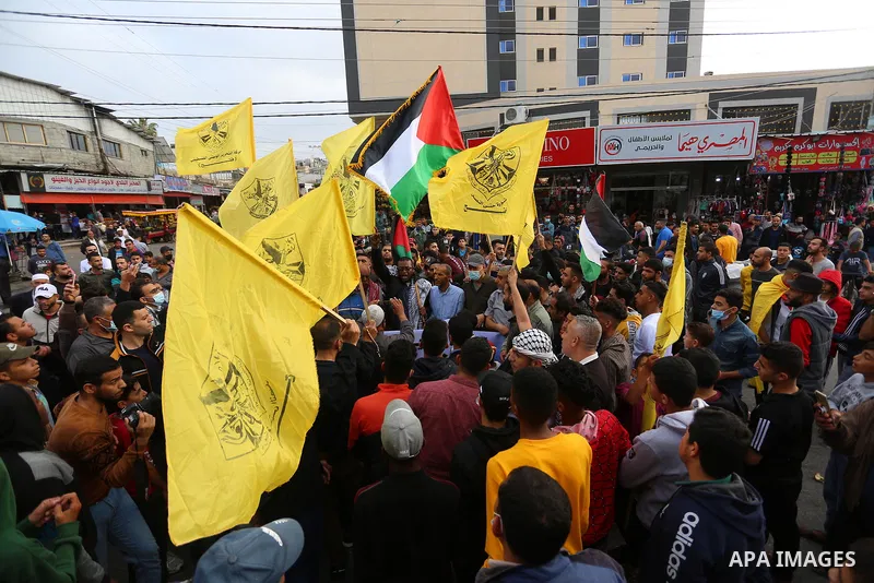 Palestinian supporters of the Fatah movement, take part in a protest in support of the Al-Aqsa Mosque in Deir Al-Balah, middle of Gaza Strip, on April 24, 2021. The Jerusalem uprising, as it has been dubbed (in Arabic in...