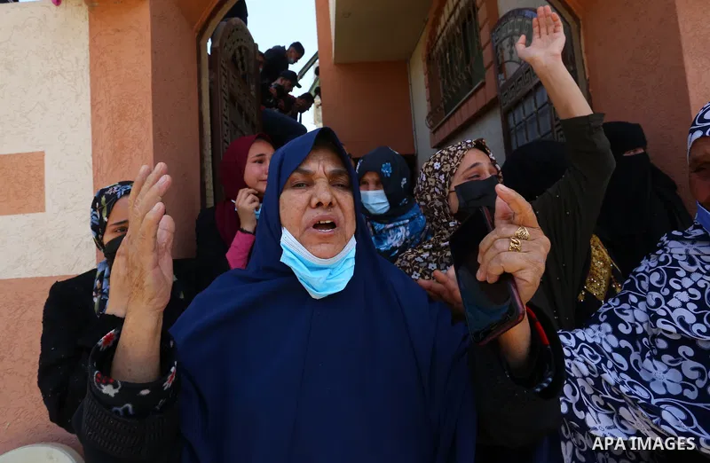 Relatives of the Palestinian Yousef Abu Jazar, mourn during his funeral, in Rafah in the southern of Gaza strip, on April 25, 2021. On Thursday, the Israeli occupation authorities delivered the body of the Palestinian ch...
