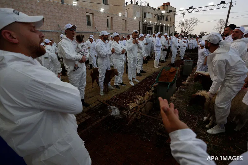 Members of the ancient Samaritan community participates in the ritual of Passover Sacrifice on Mount Gerizim, overlooking the West Bank town of Nablus, Thursday, April 25, 2021. Samaritans descended from the ancient Isra...