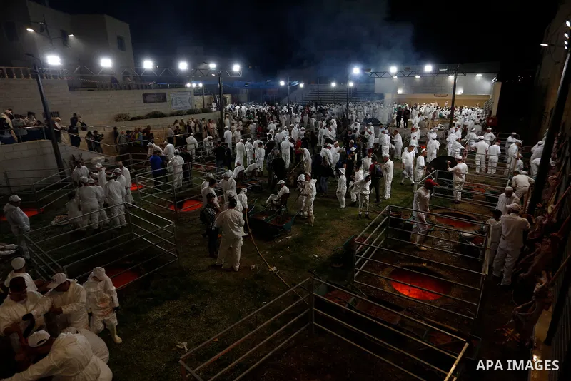 Members of the ancient Samaritan community participates in the ritual of Passover Sacrifice on Mount Gerizim, overlooking the West Bank town of Nablus, Thursday, April 25, 2021. Samaritans descended from the ancient Isra...