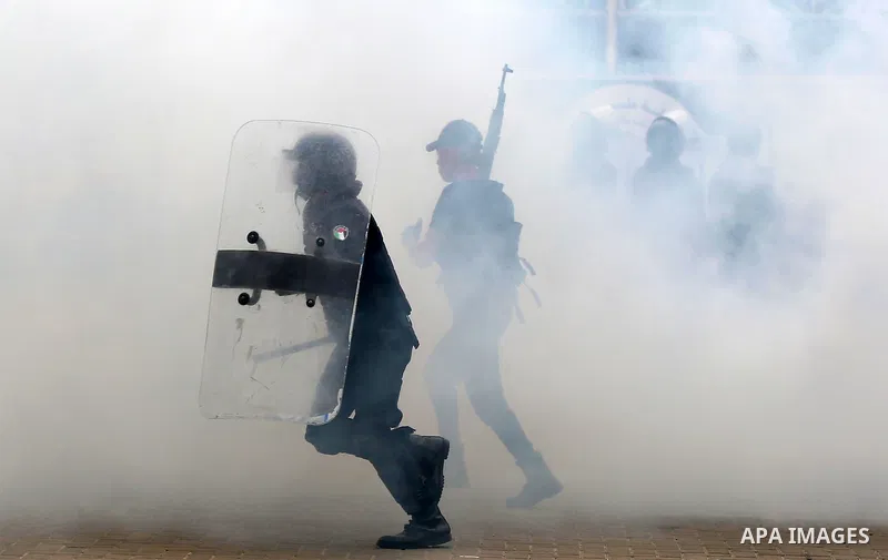 Palestinian policemen wearing protective face masks take part in a graduation ceremony, amid concerns about the spread of the coronavirus disease (COVID-19) at Ribat University College, in Gaza City on April 26, 2021. Th...