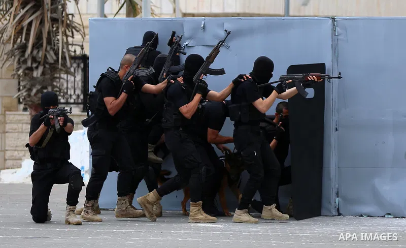 Palestinian policemen wearing protective face masks take part in a graduation ceremony, amid concerns about the spread of the coronavirus disease (COVID-19) at Ribat University College, in Gaza City on April 26, 2021. Th...