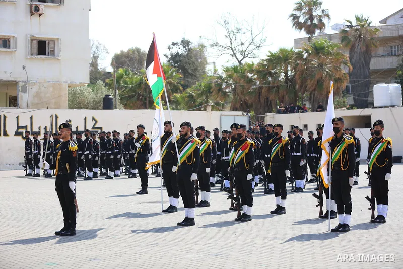 Palestinian policemen wearing protective face masks take part in a graduation ceremony, amid concerns about the spread of the coronavirus disease (COVID-19) at Ribat University College, in Gaza City on April 26, 2021. Th...