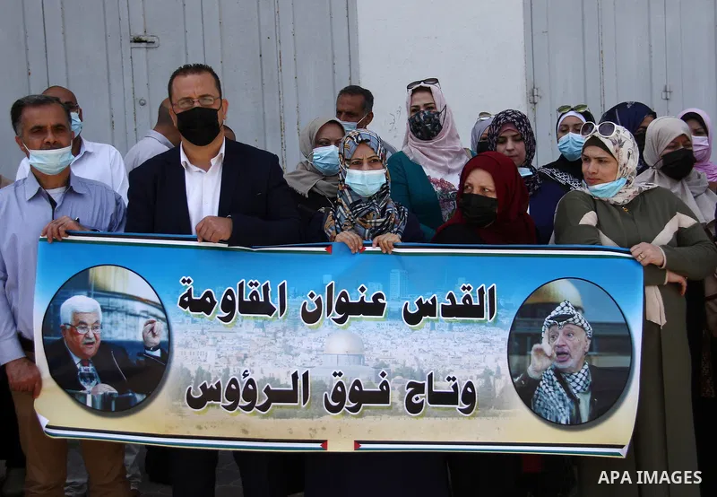 Palestinian journalists take part in a protest in support of at the Al-Aqsa Mosque, in Gaza city, on April 27, 2021. In Jerusalem, hundreds of Palestinians danced and sang at the Damascus Gate plaza after the Israeli dec...