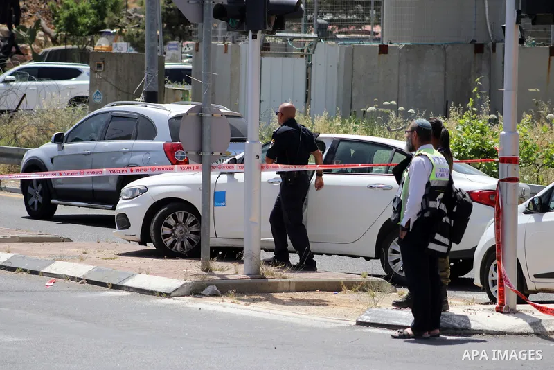 Israeli troops and medics gather at the spot where a suspected Palestinian attempted to stab a soldier on the northern entrance of the Jewish settlement of Efrat south of Bethlehem in the occupied West Bank on April 30,...