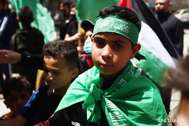 Supporters of the Hamas movement take part in a rally against the decision of the Palestinian authorities president to delay the legislative and presidential polls scheduled for May 22 and July 31, respectively, in Gaza...
