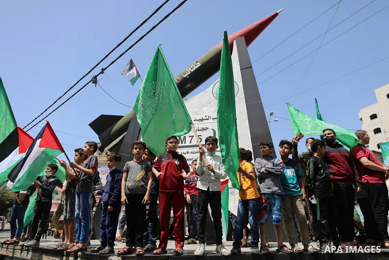 Supporters of the Hamas movement take part in a rally against the decision of the Palestinian authorities president to delay the legislative and presidential polls scheduled for May 22 and July 31, respectively, in Gaza...