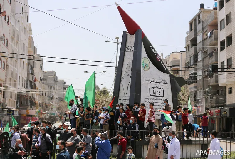 Supporters of the Hamas movement take part in a rally against the decision of the Palestinian authorities president to delay the legislative and presidential polls scheduled for May 22 and July 31, respectively, in Gaza...