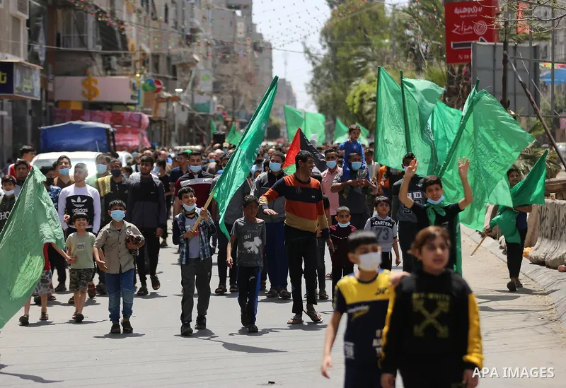 Supporters of the Hamas movement take part in a rally against the decision of the Palestinian authorities president to delay the legislative and presidential polls scheduled for May 22 and July 31, respectively, in Gaza...