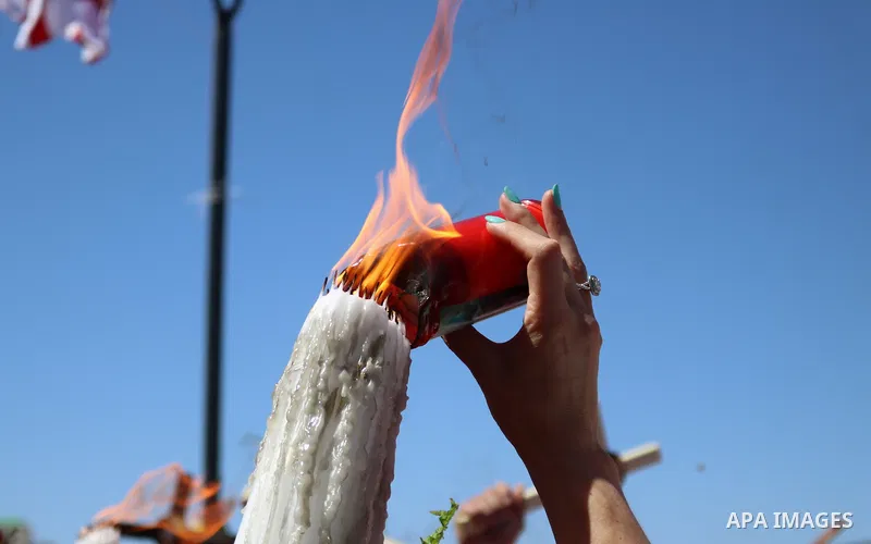 Christian worshippers take part in the Holy Fire ceremony in Bethlehem's Church of the Nativity in the Israeli-occupied West Bank, on May 1, 2021, on the eve of Orthodox Easter. Photo by Mosab Shawer