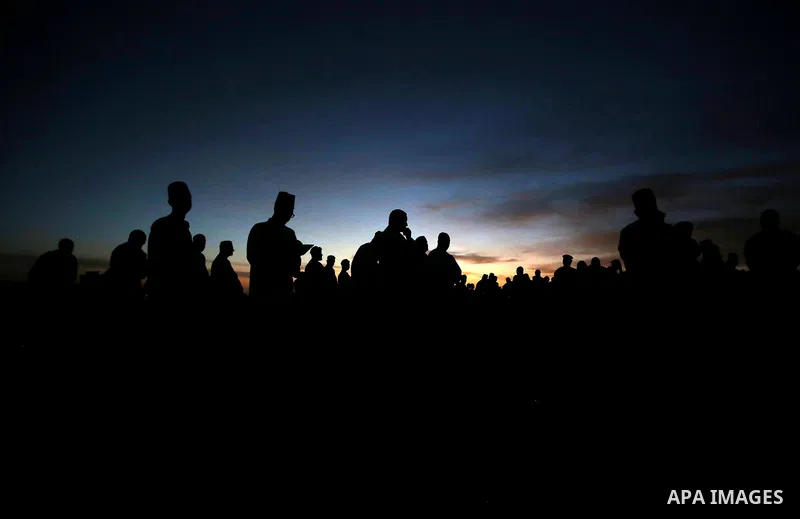 Members of the Samaritan community pray at sunrise during a religious service marking the end of their Passover holiday atop Mount Gerizim, above the West Bank city of Nablus, 02 May 2021. According to tradition, the Sam...