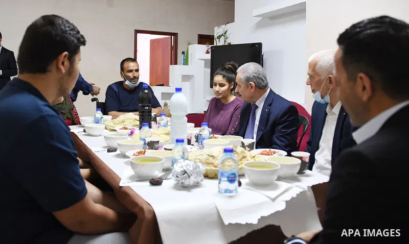 Palestinian Prime Minister Mohammad Ishtayeh, attends Ramadan break fast with the family of Mahmoud Qatoush, in the West Bank city of Ramallah on May 2, 2021. Photo by Prime Minister Office