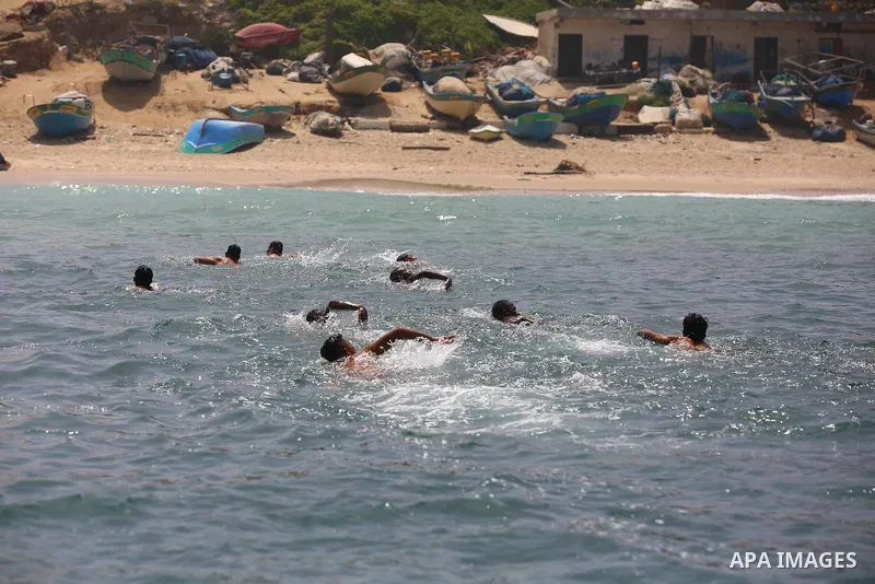 Palestinian swimmers compete during sea rescuer competition, which was organize by Ministry of Local Government with the Navy Police to choose a sea rescuer in Deir al-Balah in the center of Gaza Strip, on May 3, 2021. T...