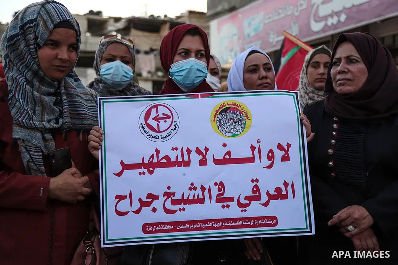 Palestinians take part during a protest against postponement of the Palestinian parliamentary and presidential elections, and against the forcible evictions of Palestinians from their homes in the Sheikh Jarrah neighborh...