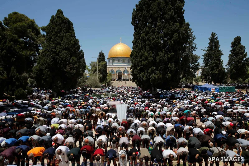 Palestinian Muslims pray on the last Friday of Ramadan outside the Dome of the Rock mosque at the al-Aqsa mosque compound, Islam’s third holiest site, in Jerusalem's old city, on May 07, 2021. Photo by Jamal Awad