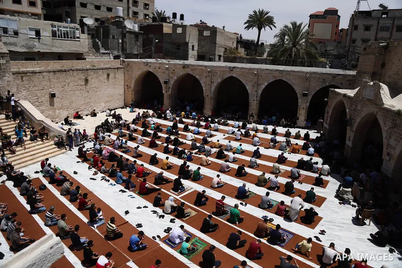 Palestinian Muslims pray on the last Friday of Ramadan at al-Omari mousque in Gaza city amid the COVID-19 pandemic on May 07, 2021. Photo by Mahmoud Ajjour