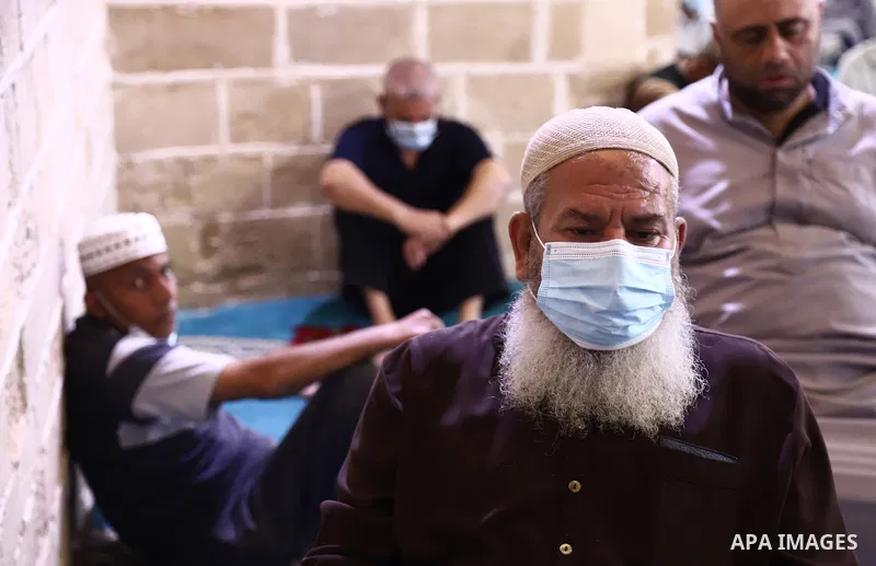 Palestinian Muslims pray on the last Friday of Ramadan at al-Omari mousque in Gaza city amid the COVID-19 pandemic on May 07, 2021. Photo by Mahmoud Ajjour