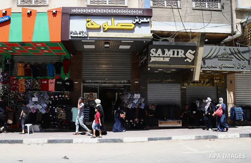 Palestinians shop at a market in Gaza City a head of Eid al-Fitr on May 07, 2021. Eid al-Fitr marks the end of Muslim's holy fasting month of Ramadan when faithfuls abstain from eating, drinking, smoking and sexual activ...