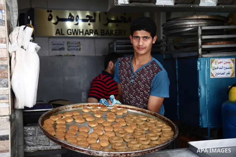 Palestinians shop at a market in Gaza City a head of Eid al-Fitr on May 07, 2021. Eid al-Fitr marks the end of Muslim's holy fasting month of Ramadan when faithfuls abstain from eating, drinking, smoking and sexual activ...