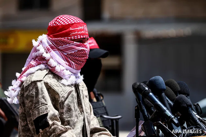Palestinian militant of the National Resistance brigades, the armed wing of the Democratic Front for the Liberation of Palestine (DFLP), Abu Khaled, speaks during a press confernce about the events in Jerusalem in Gaza C...