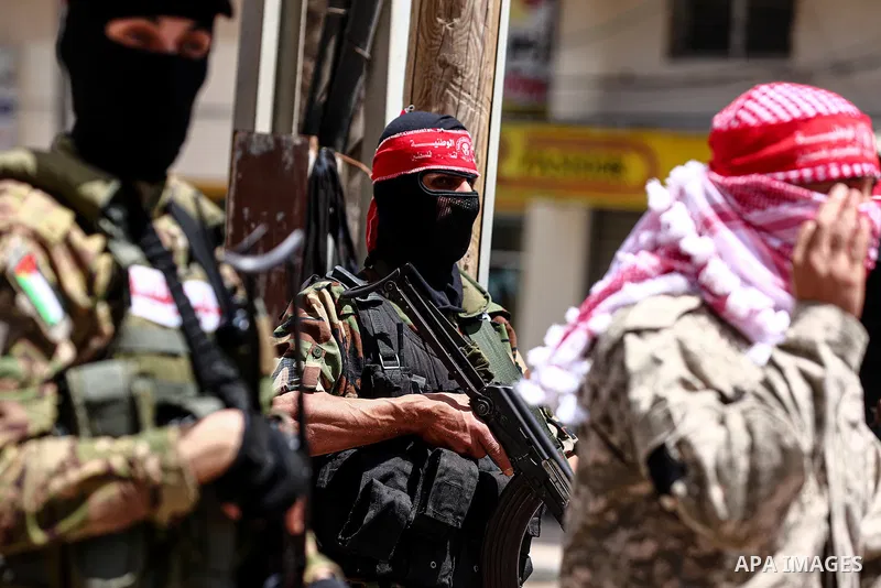 Palestinian militant of the National Resistance brigades, the armed wing of the Democratic Front for the Liberation of Palestine (DFLP), Abu Khaled, speaks during a press confernce about the events in Jerusalem in Gaza C...