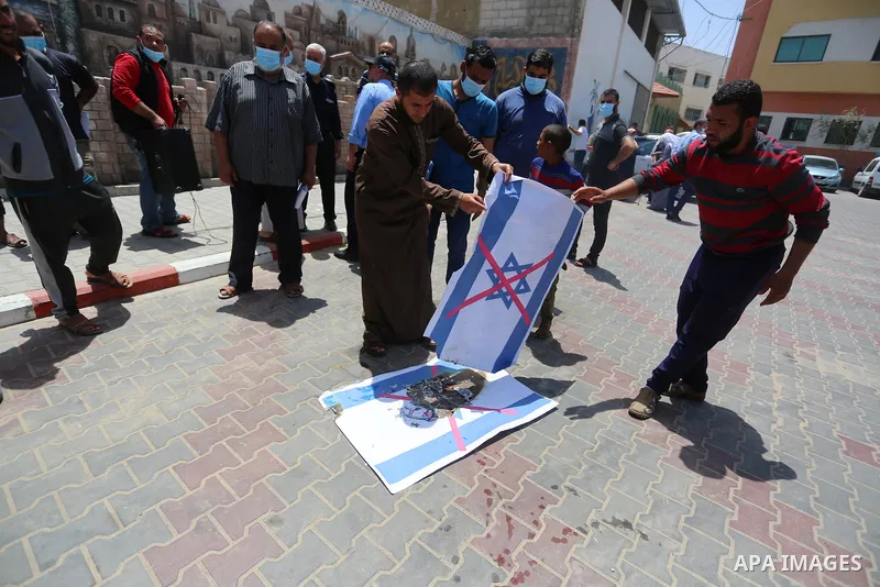 Palestinians take part in a prtoest in solidarity with Sheikh Jarrah neighbourhood, in Deir Al-Balah in the center of Gaza Strip on May 08, 2021. More than 170 Palestinians have been injured after Israeli police stormed...
