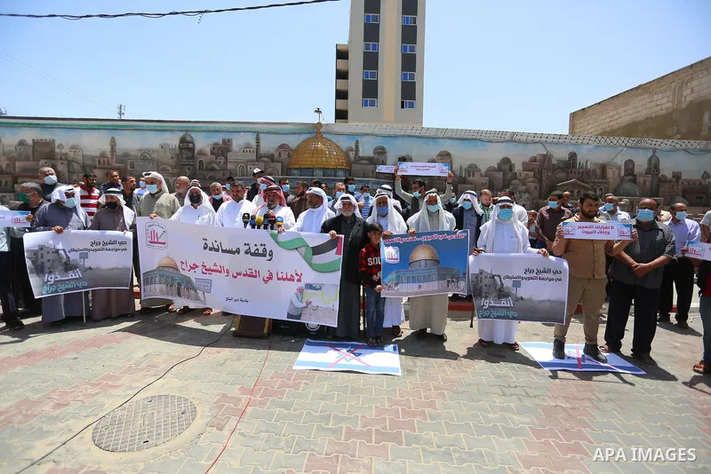 Palestinians take part in a prtoest in solidarity with Sheikh Jarrah neighbourhood, in Deir Al-Balah in the center of Gaza Strip on May 08, 2021. More than 170 Palestinians have been injured after Israeli police stormed...
