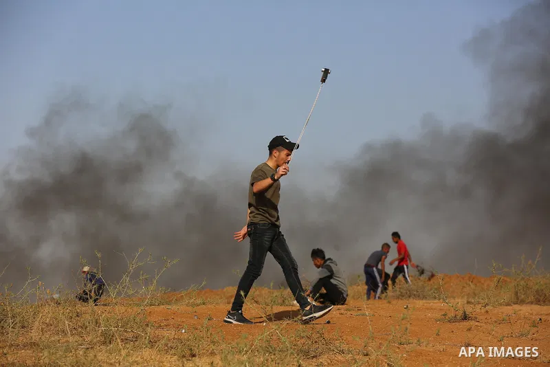 Palestinians demonstrate along the Israel-Gaza border, east of Khan Yunis town in the southern Gaza Strip on May 8, 2021. - Israel braced for more protests after clashes at Jerusalem's flashpoint Al-Aqsa Mosque compound...