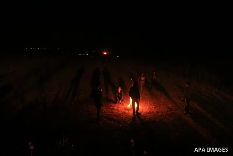 Palestinian protesters burn tyres during a demonstration along the Israel-Gaza border, east of Gaza city on May 8, 2021. Photo by Dawoud Abo Alkas